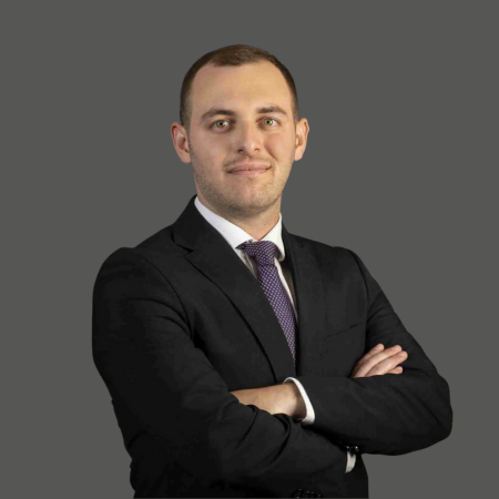 Man in suit, arms crossed