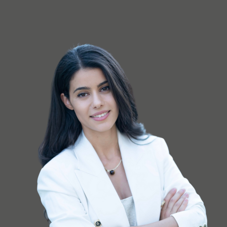 Woman in blazer, arms crossed